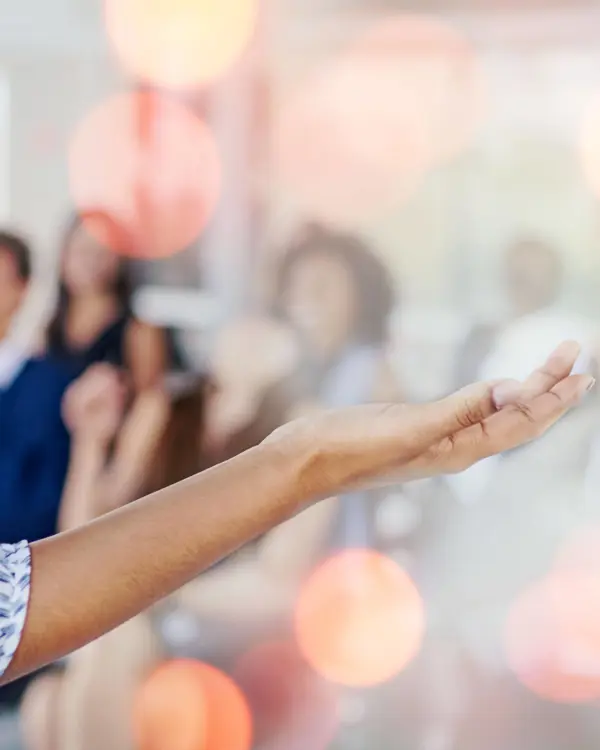 Speaker's hands gesturing towards audience Speaker's hands gesturing towards audience