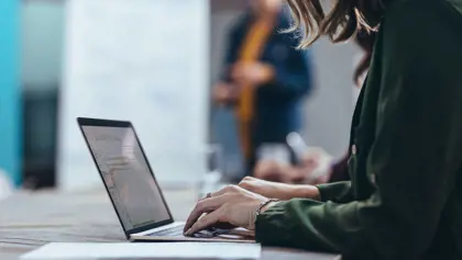 Person working at a laptop. Person working at a laptop.