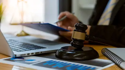 Judge gavel beside a laptop Judge gavel beside a laptop